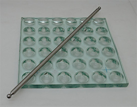 Ball bar and balls plate, developed in the a accredited Laboratory of Metrology at ICAT to support metrology by coordinates.