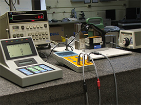Here, an array of interferometer, electronic level, and tilting table, to calibrate a level in tenths of seconds.